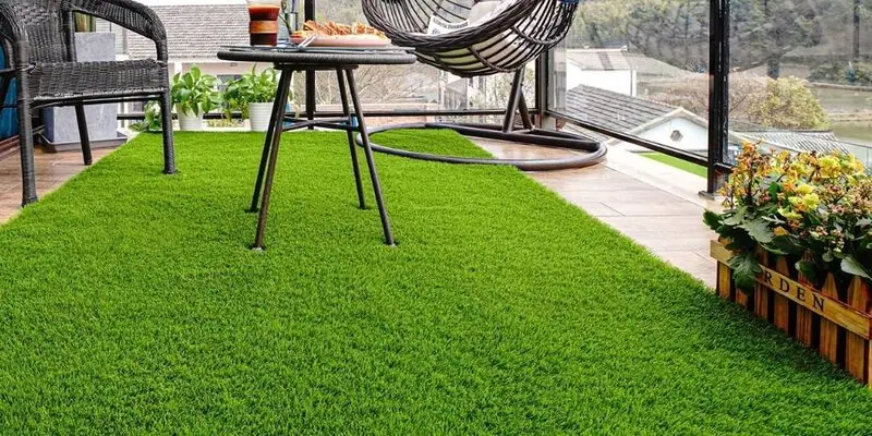 Artificial grass installation in a tidy urban garden