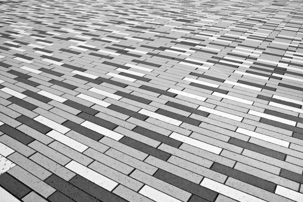 Patterned concrete paver installation for durable outdoor walkways and patios.